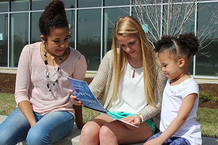 Battle students read to their client.
