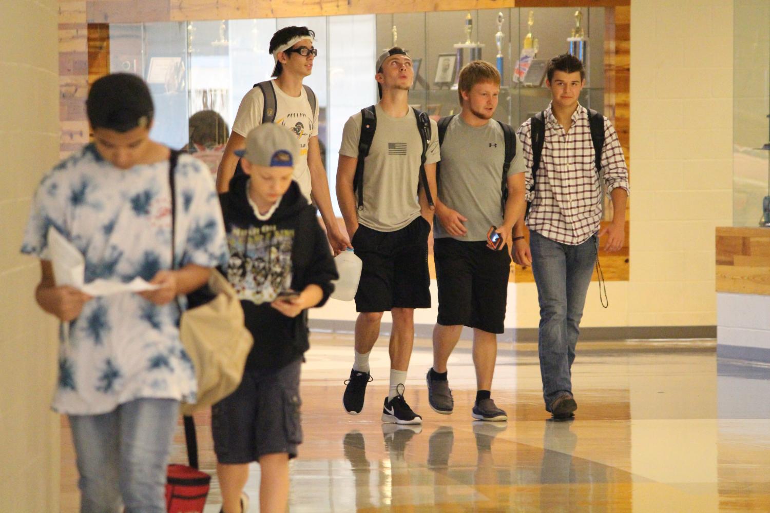 Jason McGuire, Jackson Keller, Payton Roberts, and Nick Schlude find their classes on the first day of school.