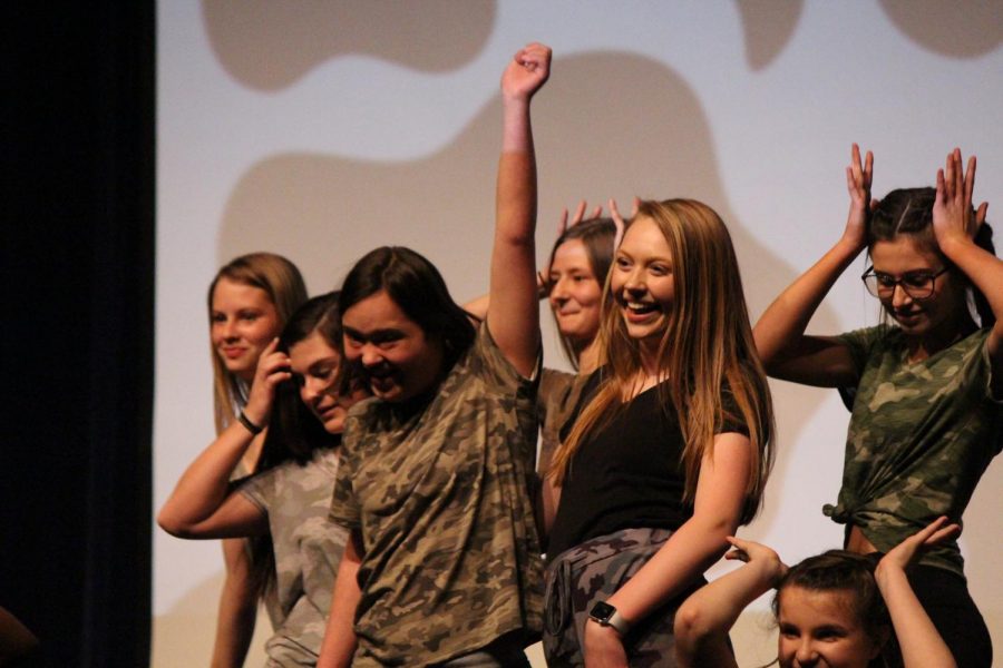 Battle's team, (the Babe Bunch), welcomes Avery McCubbin onstage. (Adrian Maddox)