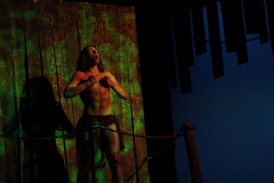 Jaydin Froeschner beats on his chest in this years Tarzan Musical.