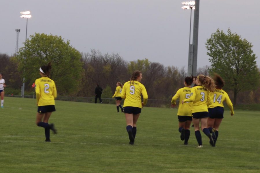 Natalie Giltrap, Bridget Anich, Krista Marks, Delaney Elleberacht, and Sarai Jones jog back to their side of the fidle for kick off after scoring a goal on Fatima in the Battle vs. Fatima game.