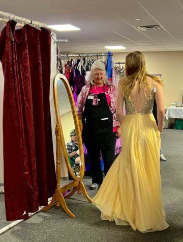Girl twirls in her dress in front of a mirror.
Taken by: Cinderellas Closet