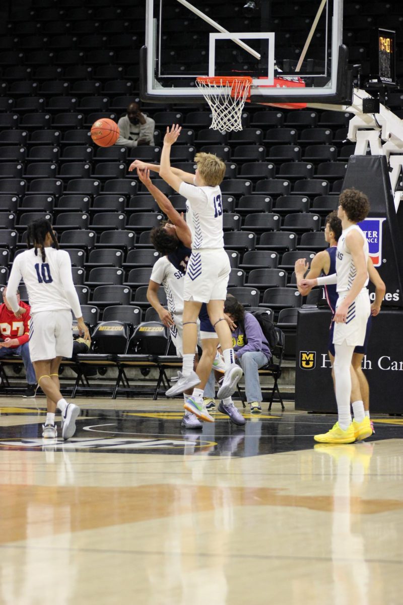 Tyler Putnam (10) Blocks a shot