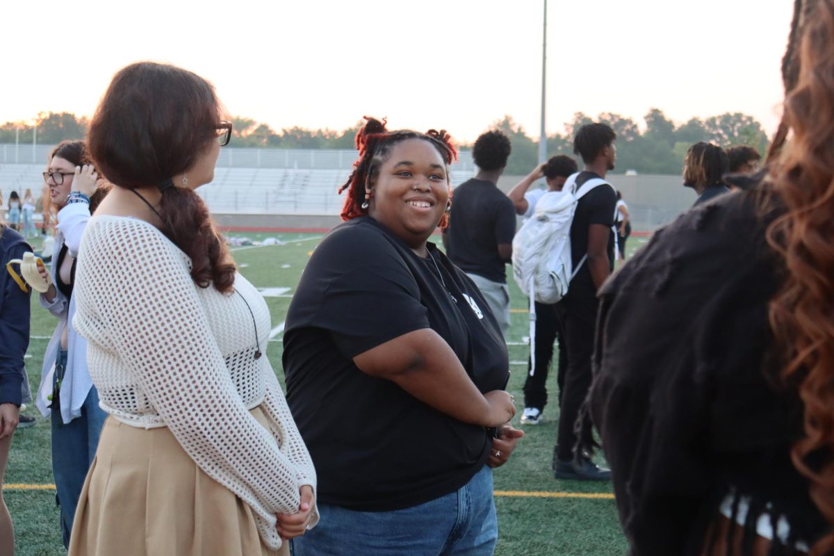 Seniors Lily McClain and Breanna Clark smile during the sunrise. Seniors participated in a Senior Sunrise on the first day of school.