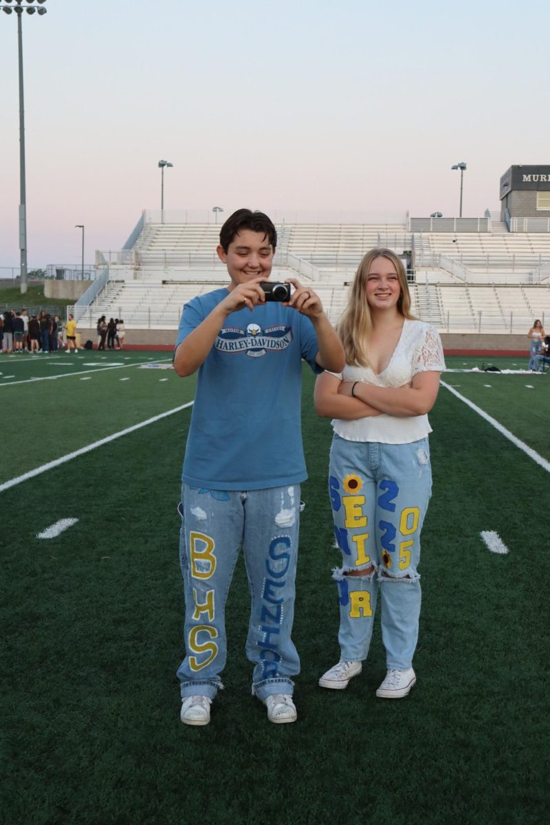 Seniors Taylor Heath and Morgan Sheaffer take picture. Seniors participated in a Senior Sunrise on the first day of school.