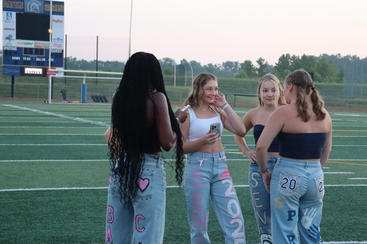 Seniors Haylie Thornhill, Wren Richardson, Maddie Samb and Joan Vallee share excitement.  Seniors participated in a Senior Sunrise on the first day of school.