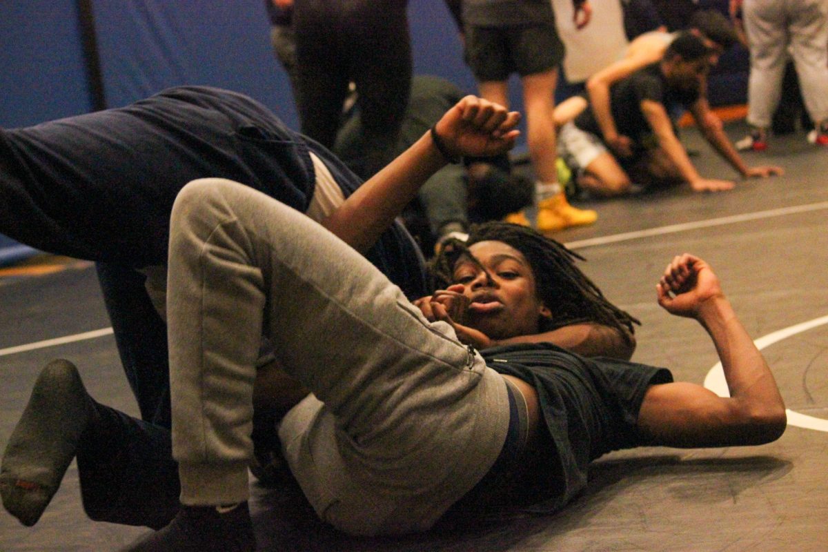 Thomas Lakes (9) slams Antoine Edward II (9) into the mat