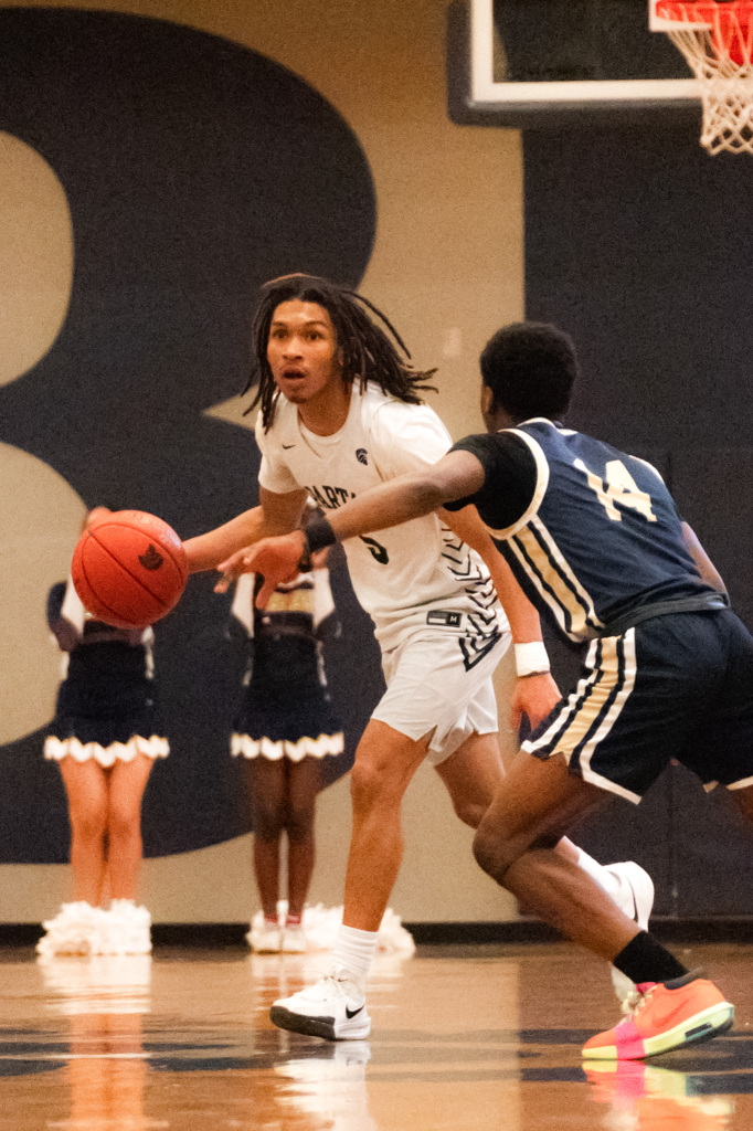 Ja'Kobi LaBoy (10) taking the ball up the court.