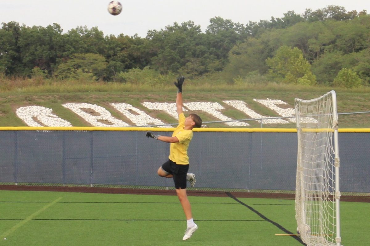 Jaedon Morgan (11) attempts to block a kick at the September 30 boys soccer practice.