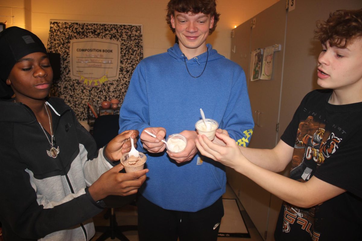 D'sean Minnis, Tre Taylor, and Ben Adam enjoy the new Ollie B's Ice Cream cups. The flavors are Chocolate, Strawberry, and Root Beer Float. 