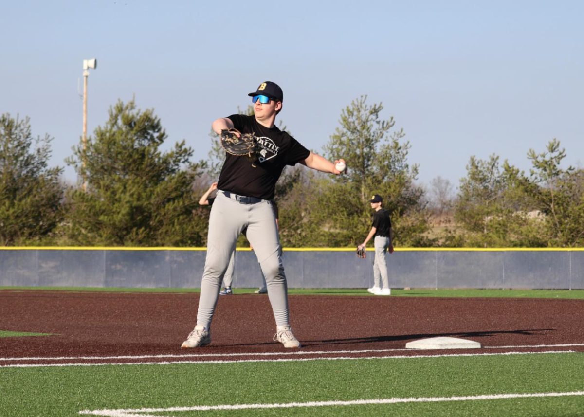 Dalton Roberts, Junior First Base, throws a ball to home plate during a spring practice. 